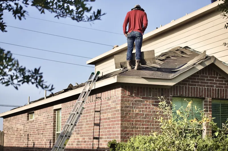 Professional roofer working on a residential roof in Wine Bel Valley